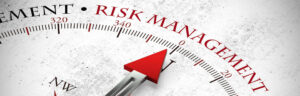 Arrow points to risk management slogan on compass