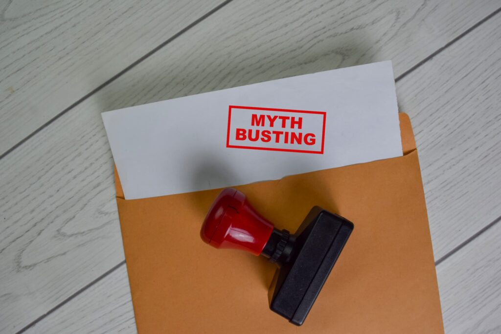 Myth Busting text on document above brown envelope - compressed